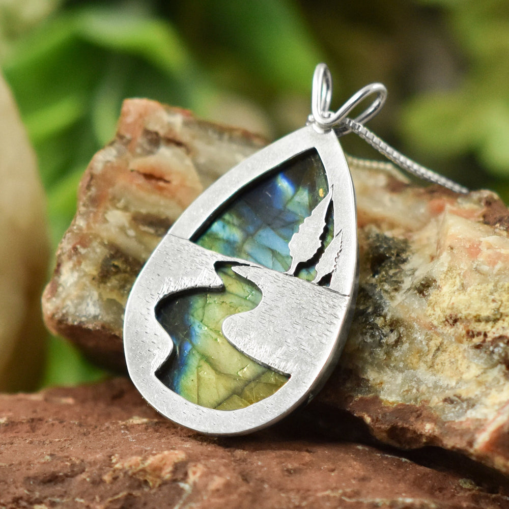 20% off storewide during our Customer Appreciation Sale at Beth Millner Jewelry, pictured is a Northern Lights Labradorite Pendant