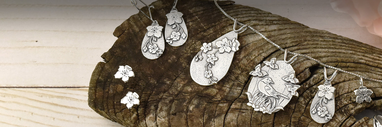 Beth Millner Jewelry new Spring Collection Robins and Apple Blossoms in recycled sterling silver made in Marquette, Michigan