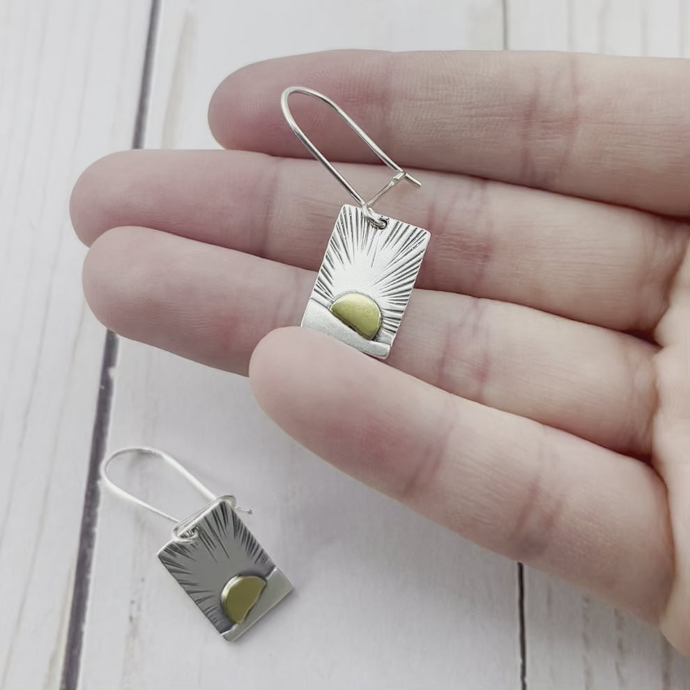 Rectangle sterling silver earrings with a brass sun. By Beth Millner Jewelry.