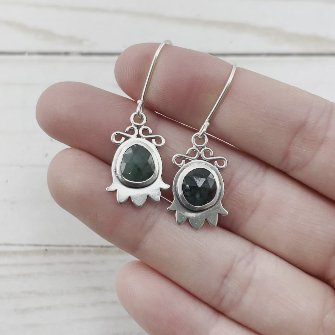 Sterling Silver Lily of the Valley drop earrings set with two emeralds. By Beth Millner jewelry.
