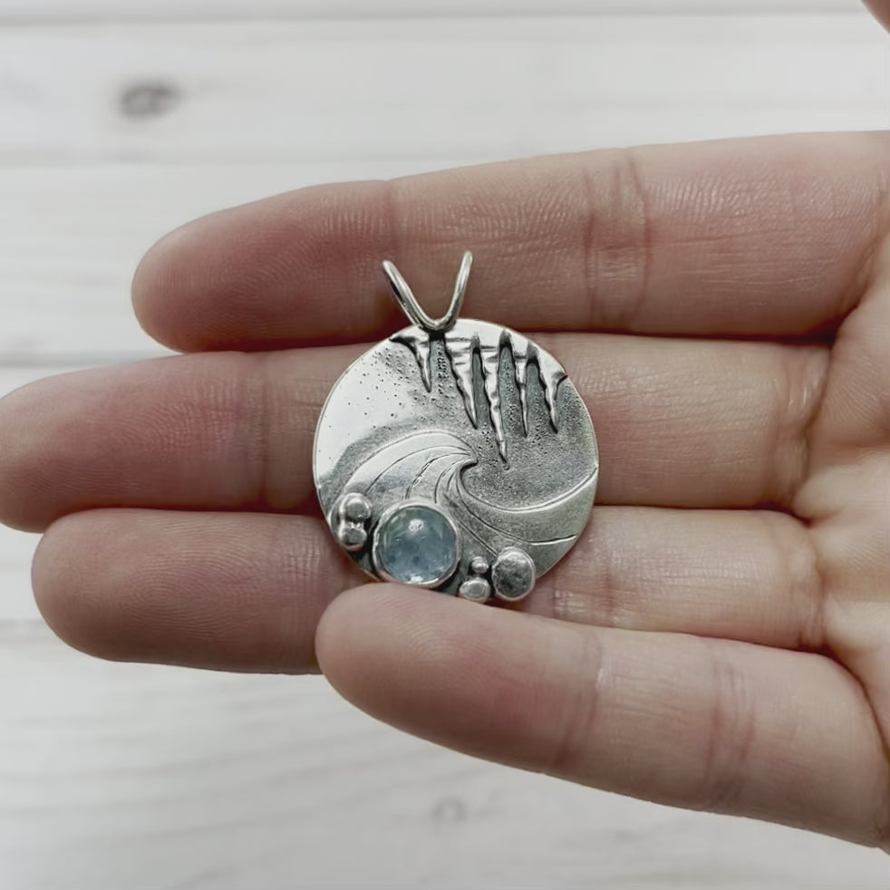 Sterling Silver Aquamarine wave pendant with pebble and icicle details.